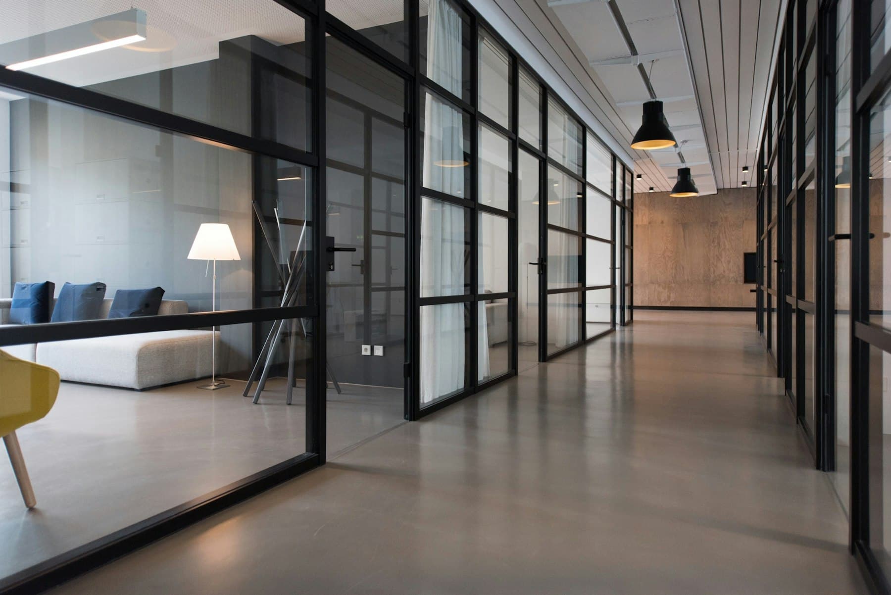 A glass-walled office floor laid out for platform teams.
